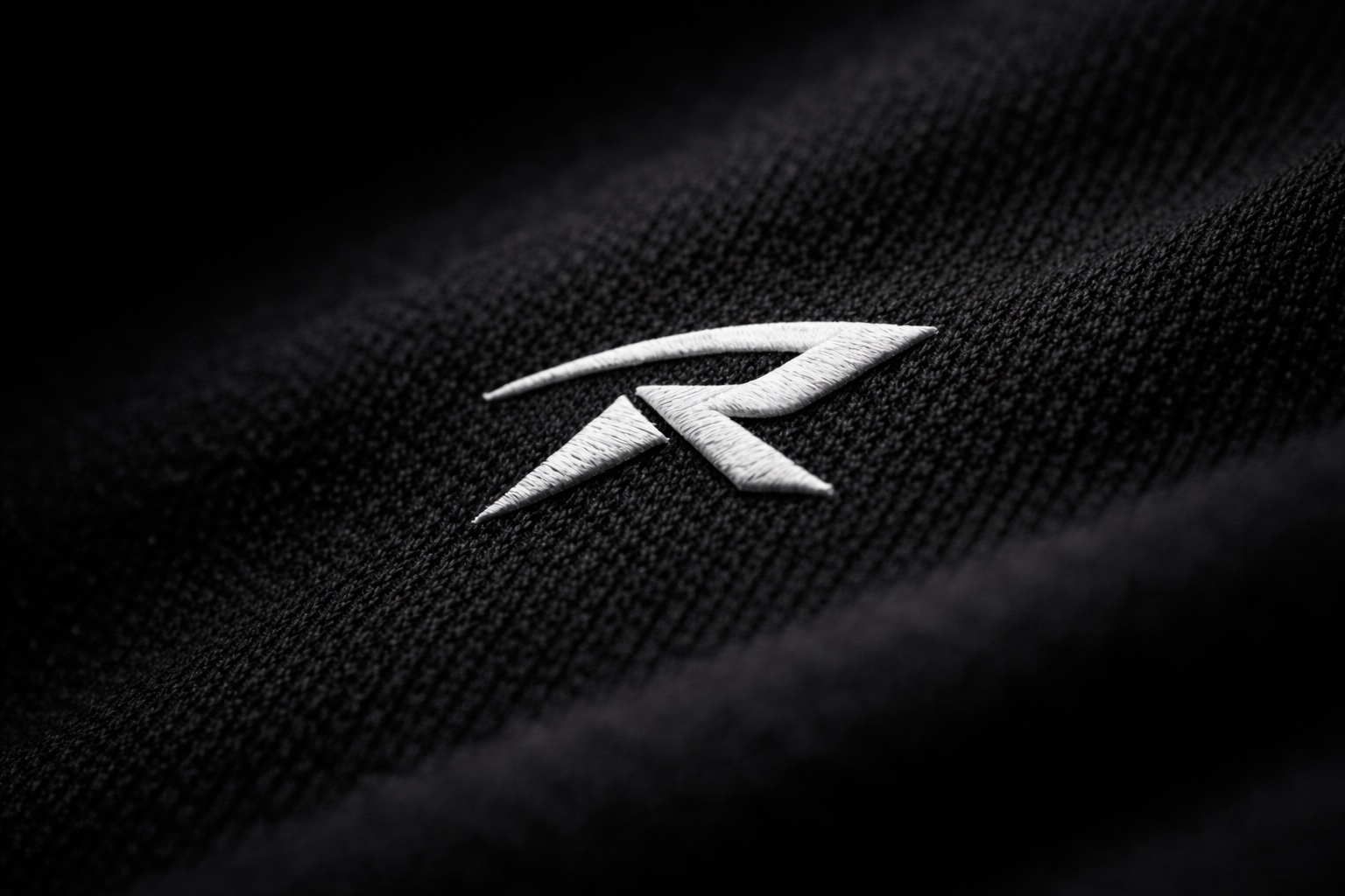 Route logo embroidered on black fabric